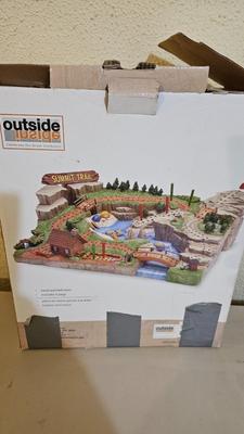 Cool Summit trail cribbage board and an assortment of playing cards and travel games