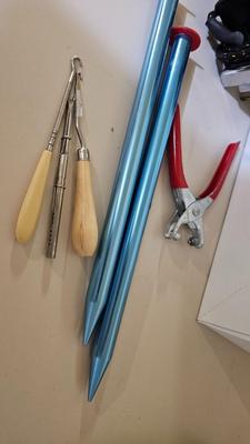 Box of sewing patterns, Singer sewing machine attachments, and assortment of other sewing needs