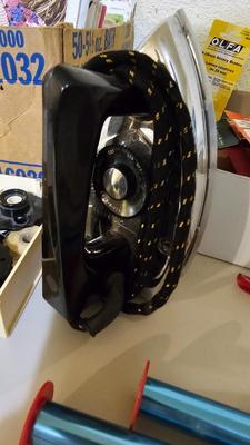 Box of sewing patterns, Singer sewing machine attachments, and assortment of other sewing needs