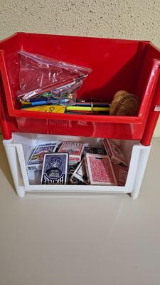 Stacking storage organizers with assortment of kid toys and crayons