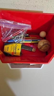 Stacking storage organizers with assortment of kid toys and crayons