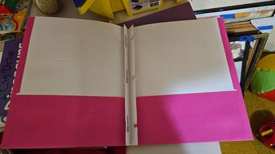 Stacking storage organizers with assortment of kid toys and crayons