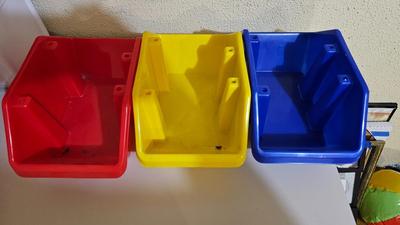 Stacking storage organizers with assortment of kid toys and crayons