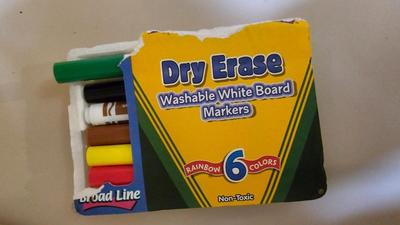 Stacking storage organizers with assortment of kid toys and crayons