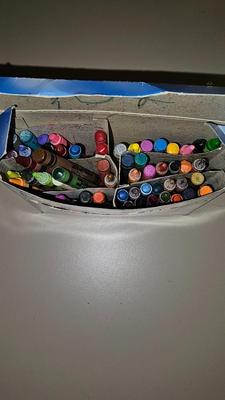 Stacking storage organizers with assortment of kid toys and crayons