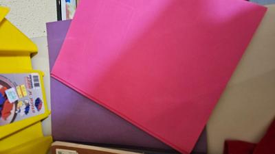 Stacking storage organizers with assortment of kid toys and crayons