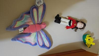 Stacking storage organizers with assortment of kid toys and crayons