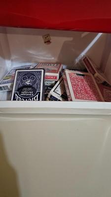 Stacking storage organizers with assortment of kid toys and crayons