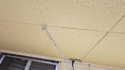 Pegboard with hardware and a nice free hanging shop light