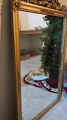 Early era Antique large mirror with ornate gold wooden frame