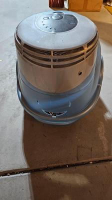 Cat litter box with air filter, toys, and food bowl