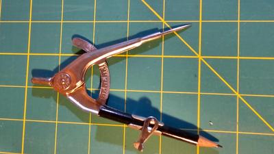 Olfa rotary mat, yard sticks, drafting compass