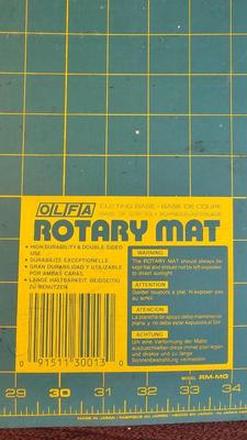 Olfa rotary mat, yard sticks, drafting compass