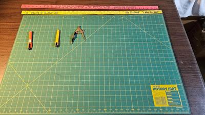 Olfa rotary mat, yard sticks, drafting compass