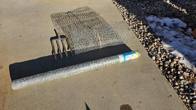 New roll 48" Hex netting fence with pitchfork and shovel heads