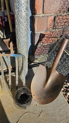 New roll 48" Hex netting fence with pitchfork and shovel heads