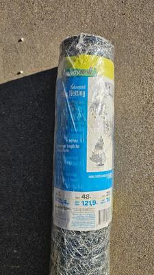 New roll 48" Hex netting fence with pitchfork and shovel heads