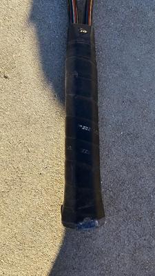 Two tennis racquets with tennis balls