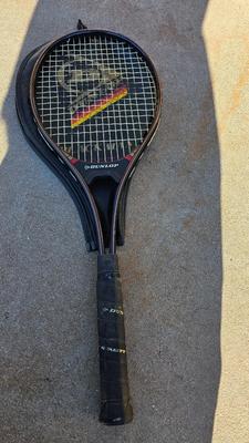 Two tennis racquets with tennis balls