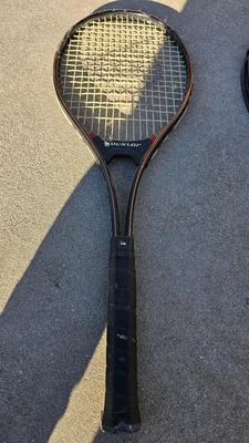 Two tennis racquets with tennis balls