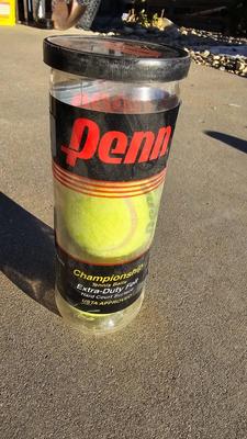 Two tennis racquets with tennis balls