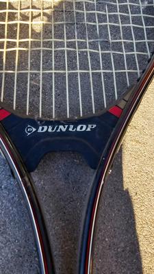 Two tennis racquets with tennis balls