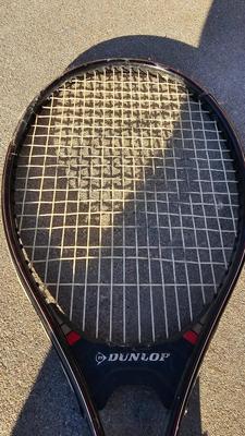 Two tennis racquets with tennis balls