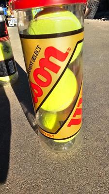 Two tennis racquets with tennis balls