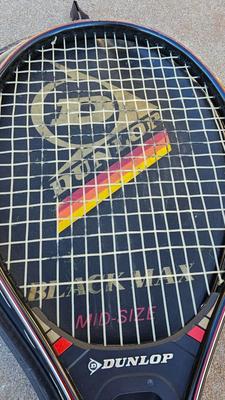 Two tennis racquets with tennis balls