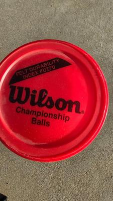 Two tennis racquets with tennis balls