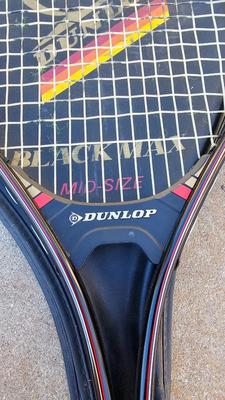Two tennis racquets with tennis balls