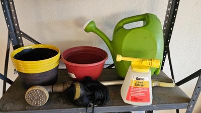 Metal shelf with planter pots weed sprayer, handcrafted plant rooters and more gardening items