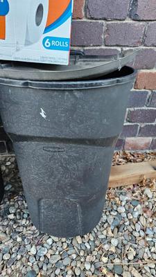 Trash cans with lids and a box of jumbo marathon 2-ply toilet paper