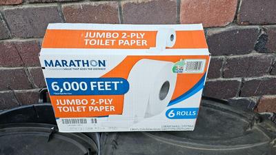Trash cans with lids and a box of jumbo marathon 2-ply toilet paper