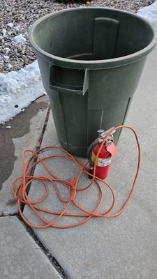 Trash can, fire extinguisher, extension cord
