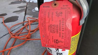 Trash can, fire extinguisher, extension cord