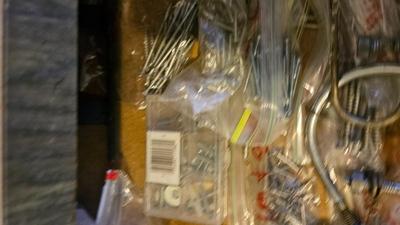 Two drawers of household hardware - screws - nails - small tools and more