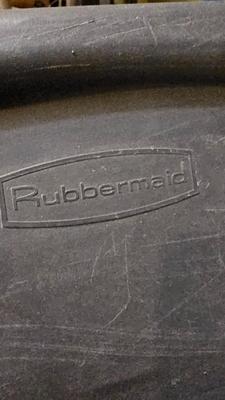 Four Rubbermaid plastic storage totes with lids