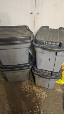Four Rubbermaid plastic storage totes with lids