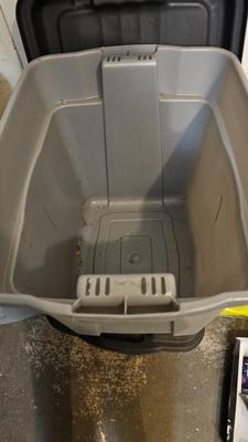 Four Rubbermaid plastic storage totes with lids