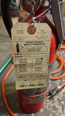 Extended Light bulb changer pole, extension cord and fire extinguisher