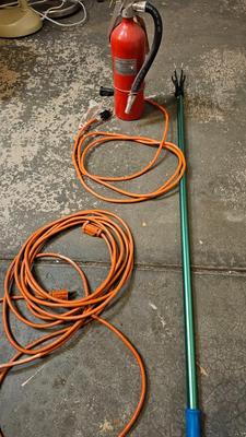 Extended Light bulb changer pole, extension cord and fire extinguisher