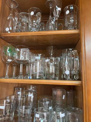 Sale Photo Thumbnail #313: Lots of clear glass drinking glasses and cups.