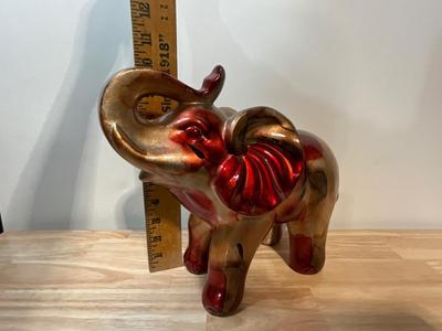 Large red and gold elephant