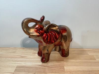 Large red and gold elephant