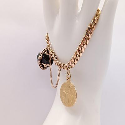 LOT 28: Vintage 18K Gold Bracelet with Charms 39.7gtw
