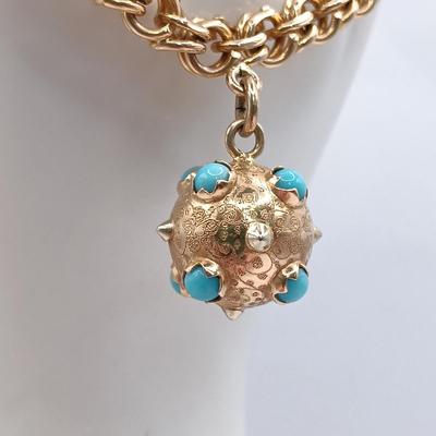 LOT 29: Stunning 18K Yellow Gold and Turquoise Charm Bracelet 32.9gtw