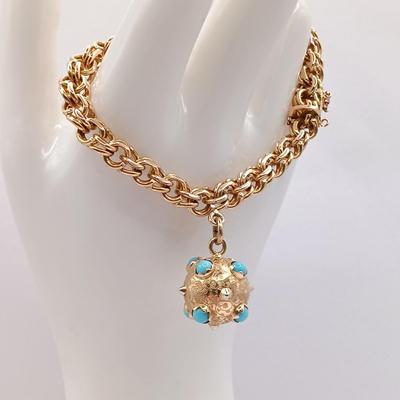 LOT 29: Stunning 18K Yellow Gold and Turquoise Charm Bracelet 32.9gtw