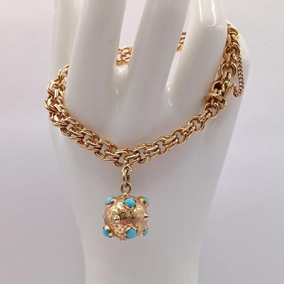 LOT 29: Stunning 18K Yellow Gold and Turquoise Charm Bracelet 32.9gtw