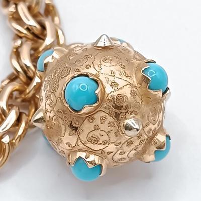 LOT 29: Stunning 18K Yellow Gold and Turquoise Charm Bracelet 32.9gtw